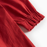 Rød julekjole med hvid krave og fine blomsterbroderier til børn