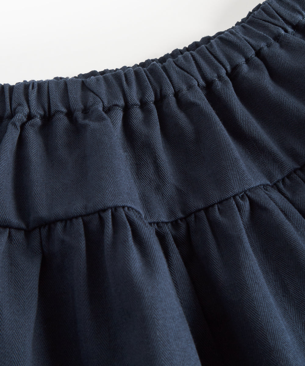 Mørkeblåt nederdel med elastisk talje og let struktur til børn