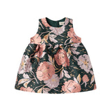 Mørkegrøn ærmeløs festkjole med store blomster og sløjfedetalje til baby