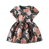 Mørkegrøn festkjole med store blomster og glansfuldt stof til børn