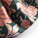 Kort mørkegrøn nederdel med store blomster og sløjfedetalje til børn