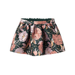 Kort mørkegrøn nederdel med store blomster og sløjfedetalje til børn