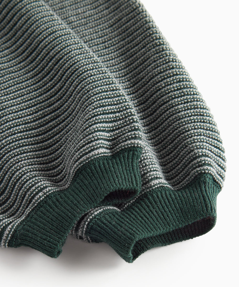 Mørkegrønne strikkede bukser med seler og fine striber til baby