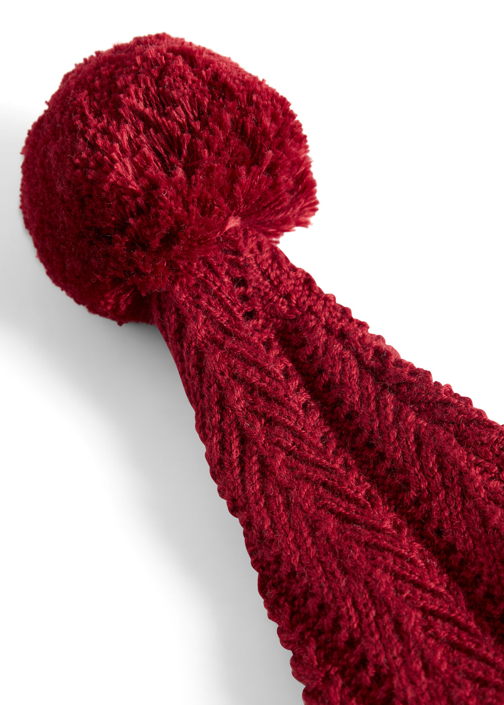 Rød strikket nissehue med kvast til baby