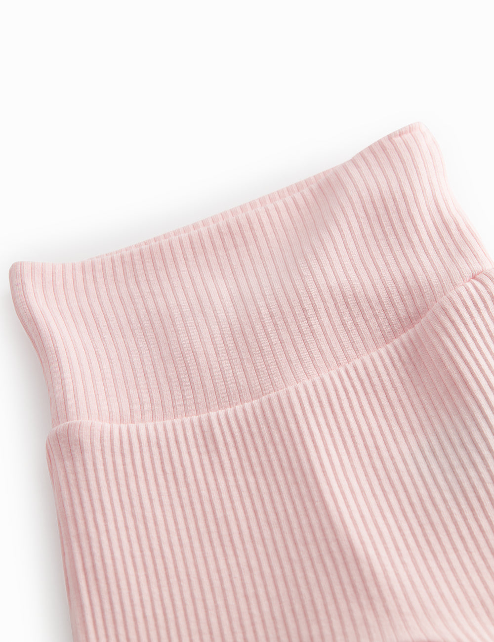 Lyserøde babybukser med fødder til de nyfødte