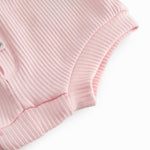 Lyserøde baby bloomers med stolpe knaplukning