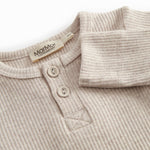 Langærmet baby modal bodystocking med stolpe knaplukning