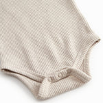 Langærmet baby modal bodystocking med stolpe knaplukning