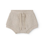 Beige baby bloomers med stolpe knaplukning og et pyntebånd i livet