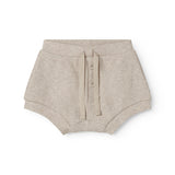 Beige baby bloomers med stolpe knaplukning og et pyntebånd i livet
