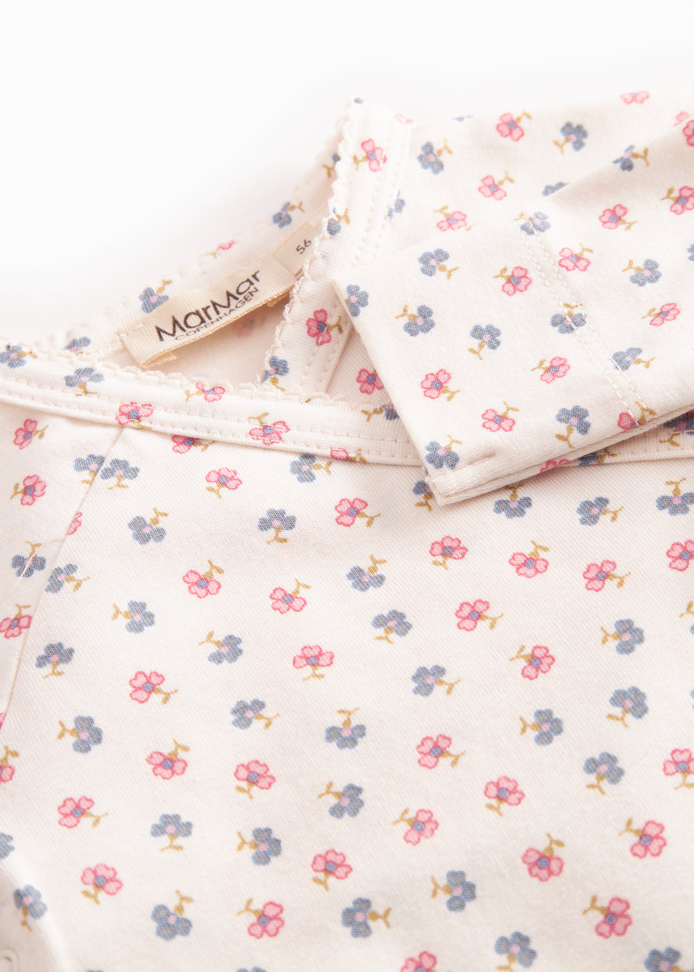 Langærmet bodystocking til nyfødt baby med slå-om-lukning og blomster