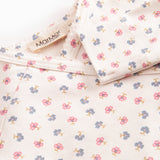 Langærmet bodystocking til nyfødt baby med slå-om-lukning og blomster