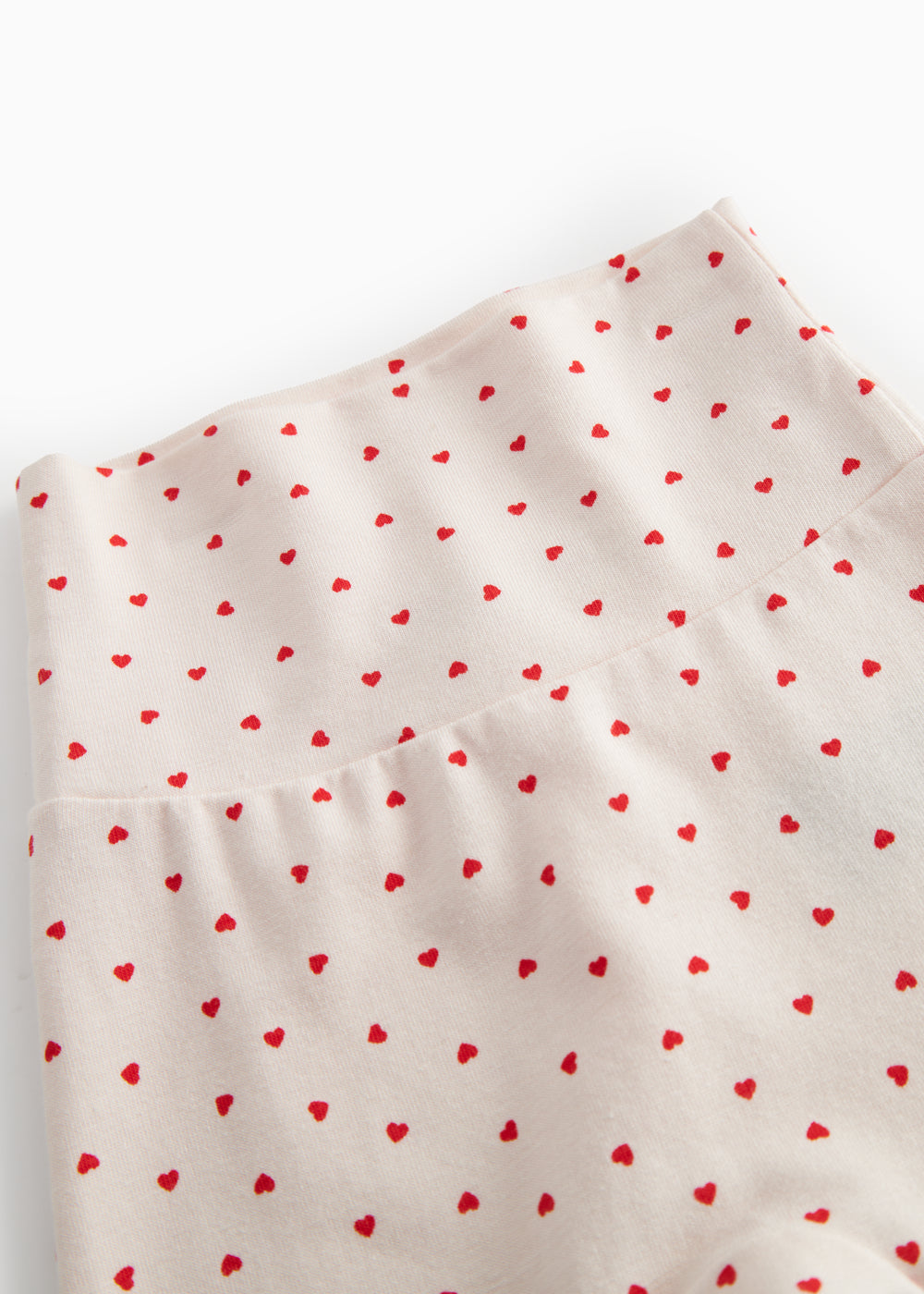 Bukser med fødder til de nyfødte med et sødt hjerte print