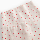 Bukser med fødder til de nyfødte med et sødt hjerte print