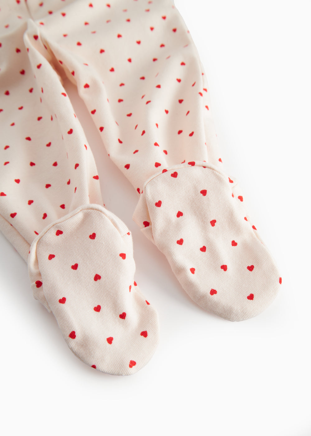 Bukser med fødder til de nyfødte med et sødt hjerte print