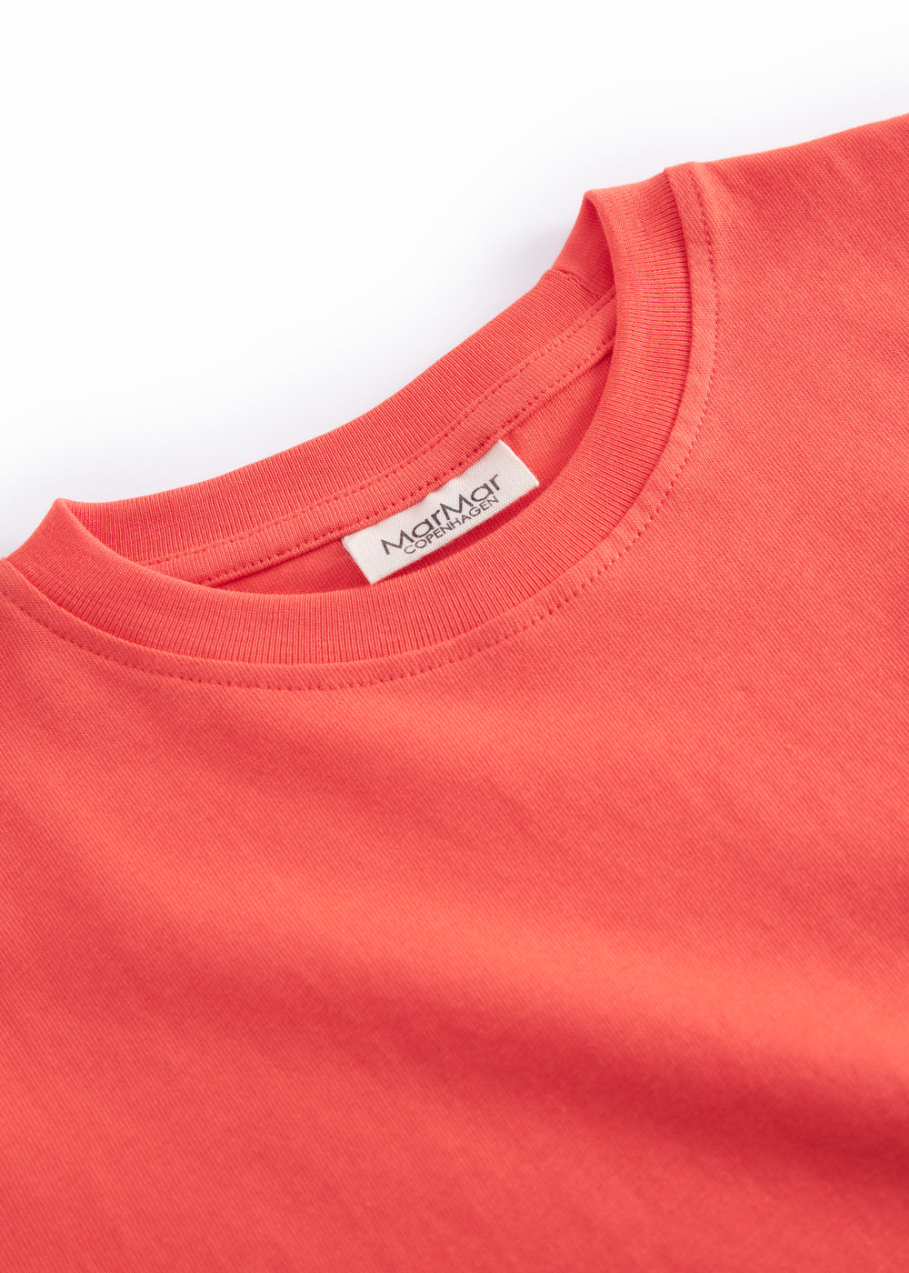 Orange børne-T-shirt med lille broderet frugtmotiv