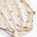 Langærmet baby bodystocking med blomstrprint og knaplukning