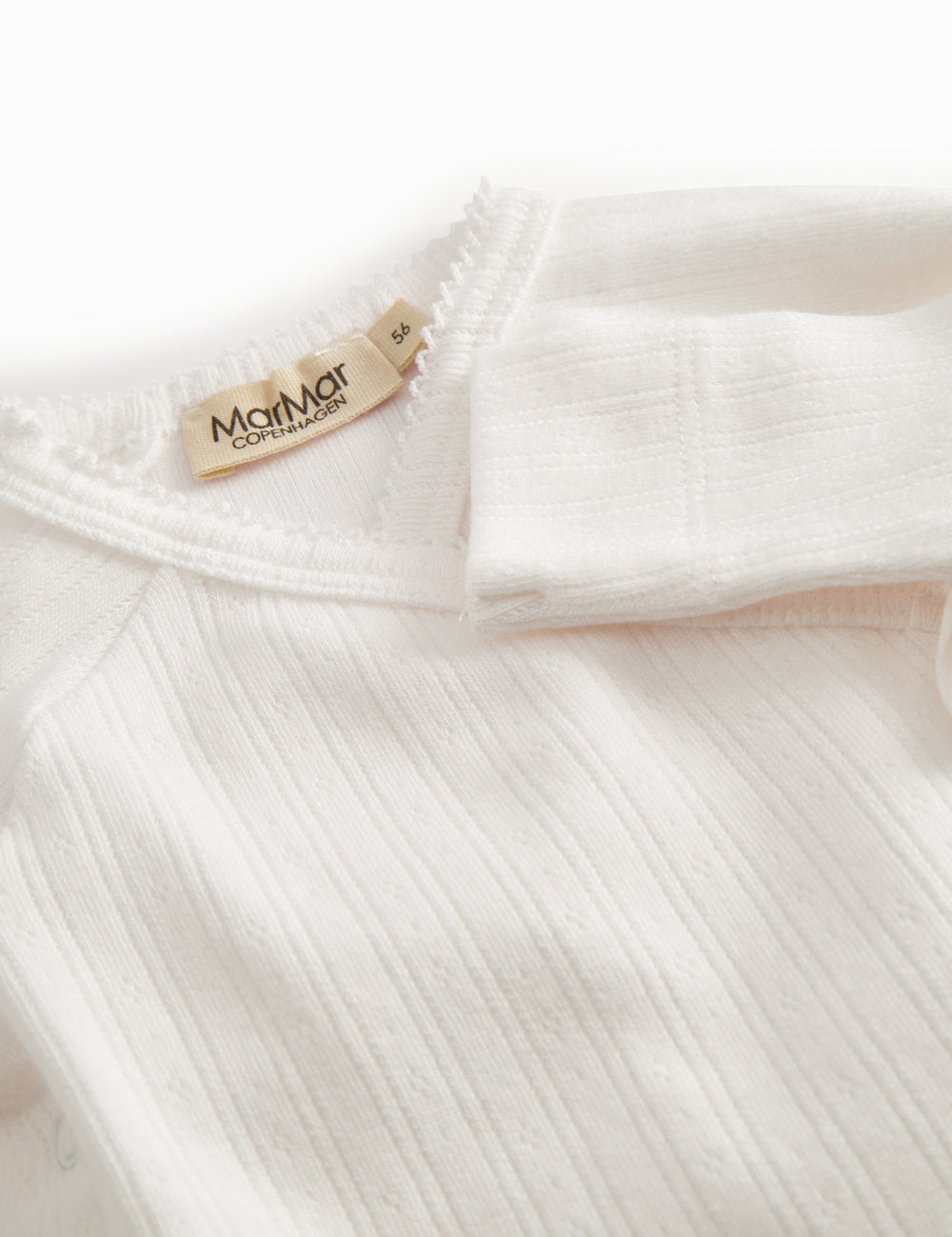 Langærmet hvid pointelle bodystocking til nyfødte