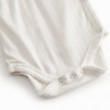 Langærmet hvid pointelle bodystocking til nyfødte