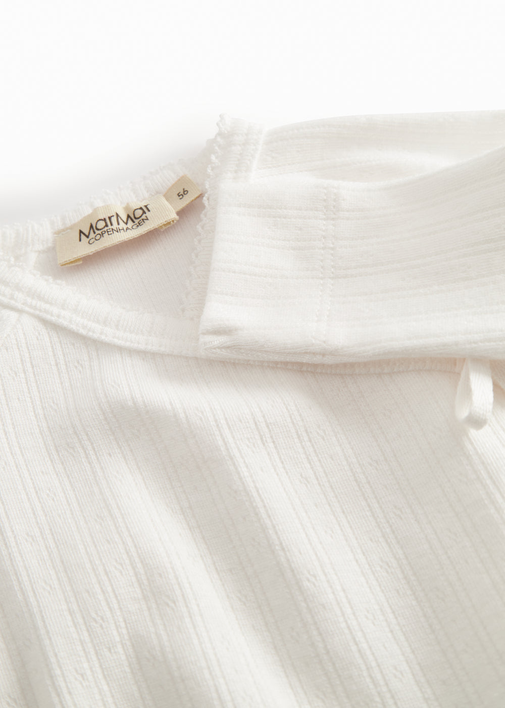 Langærmet hvid pointelle heldragt med fødder til nyfødte