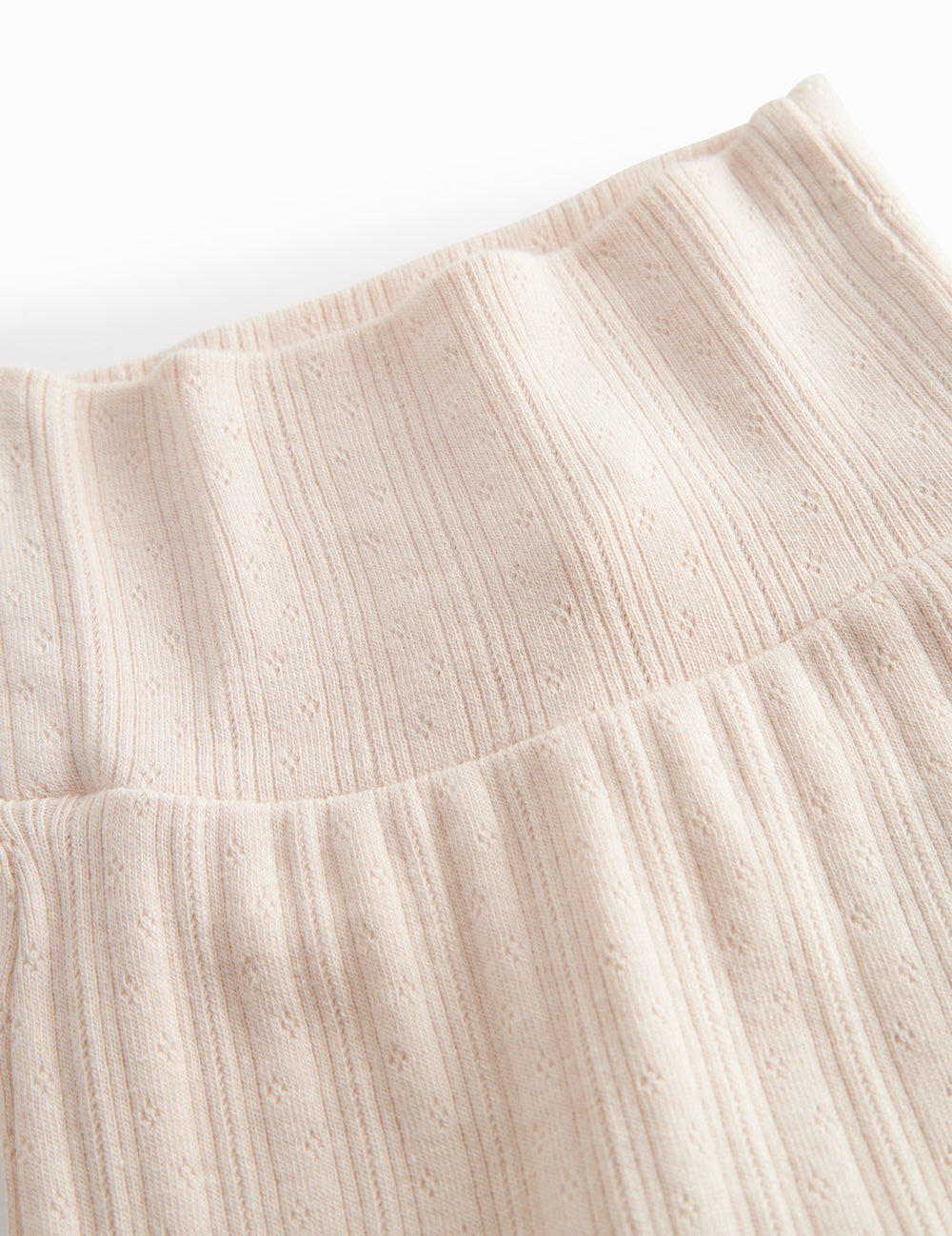 Lyserøde pointelle bukser med fødder til nyfødt baby