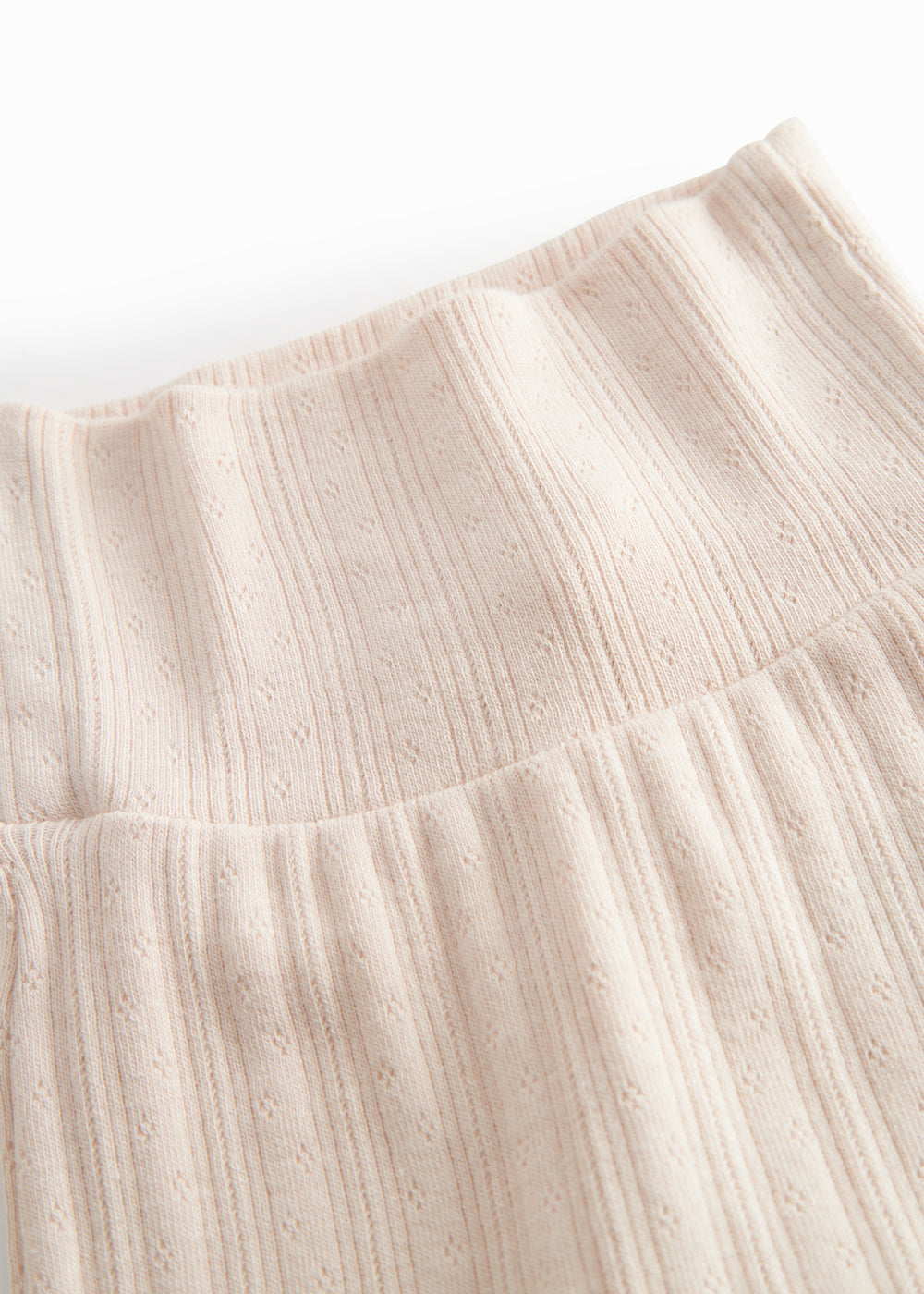 Lyserøde pointelle bukser med fødder til nyfødt baby