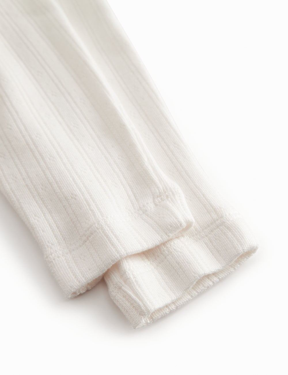 Hvide pointelle bukser til de nyfødte