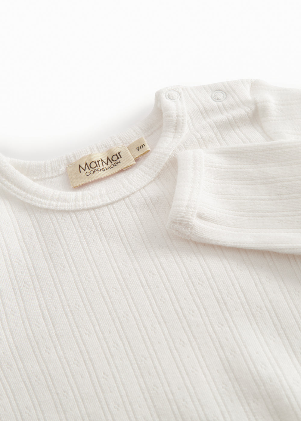 Langærmet hvid pointelle baby bodystocking