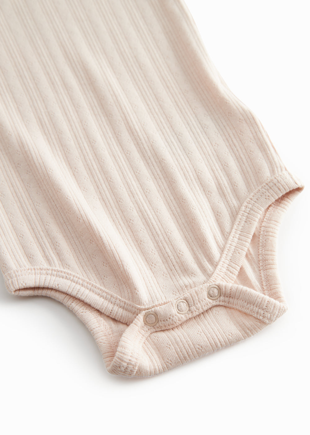 Langærmet lyserød pointelle baby bodystocking