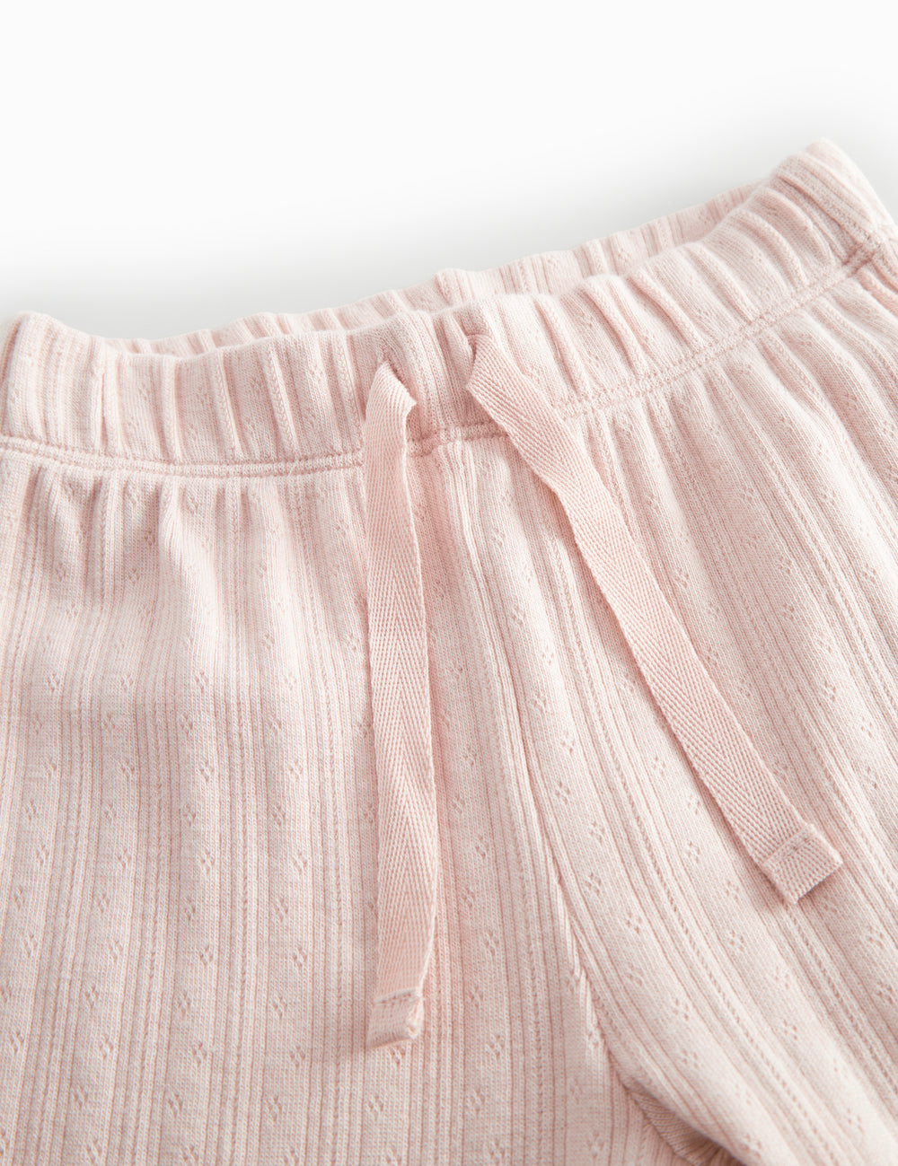 Lyserøde pointelle babybukser med elastik og  pyntebånd i livet