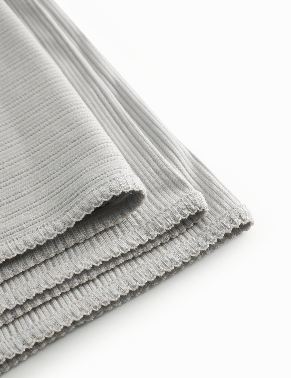 Lysegrøn pointelle babytæppe med rundede hjørner og picotkanter