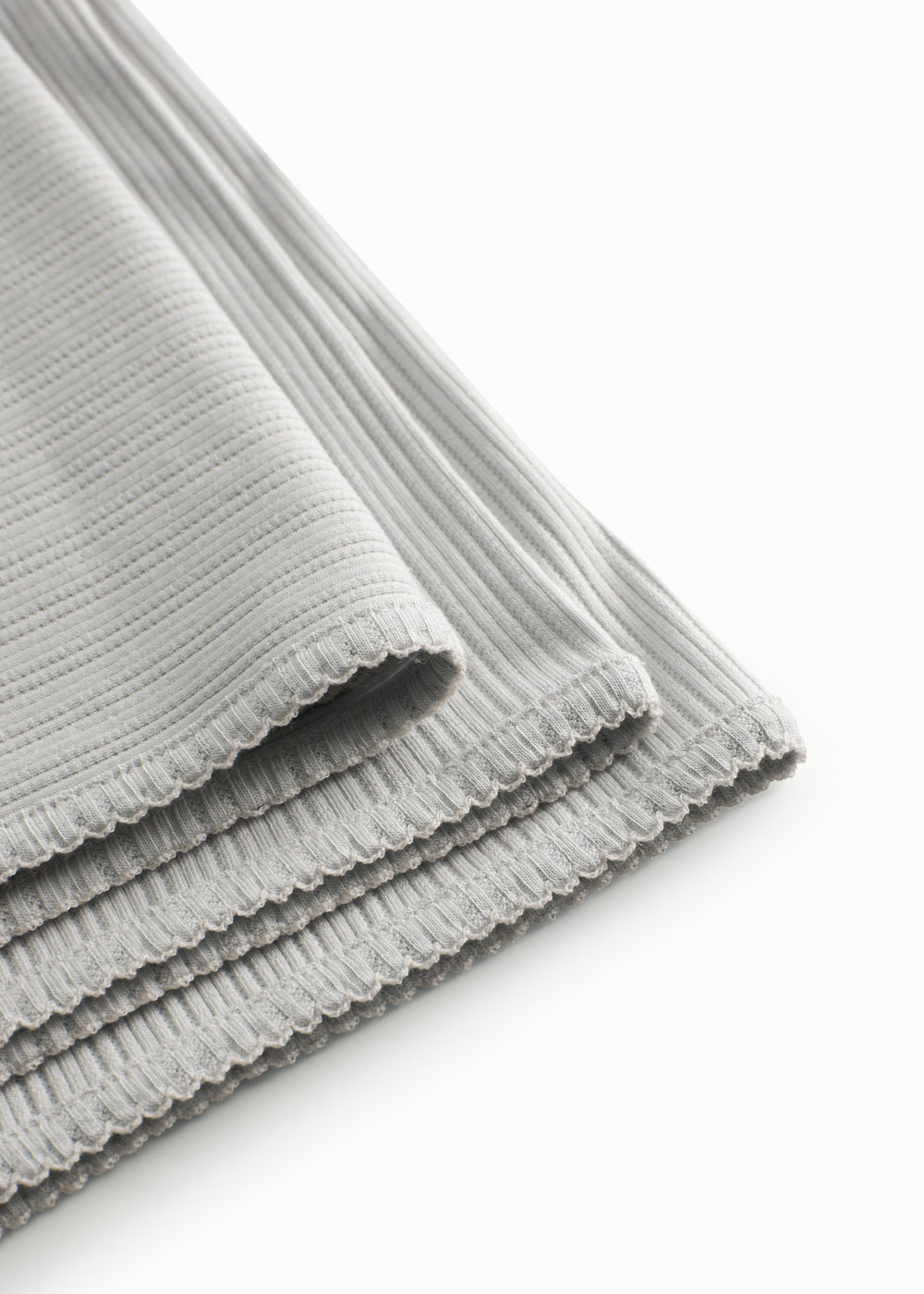 Lysegrøn pointelle babytæppe med rundede hjørner og picotkanter