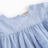 Kortærmet bluse til børn med puffærmer og fint broderimønster