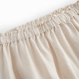 Beige bukser til baby med løs pasform  og elastik i taljen 