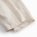 Beige bukser til baby med løs pasform  og elastik i taljen 