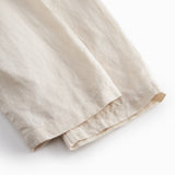 Beige bukser til baby med løs pasform  og elastik i taljen 