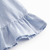 Ærmeløs top til baby med flæsedetaljer