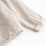 Beige langærmet skjorte til børn med kinakrave og knaplukning foran