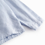 Lyseblå langærmet skjorte til børn med kinakrave og knaplukning foran