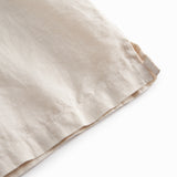 Ærmeløs beige top til børn med  flæsedetaljer