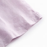 Ærmeløs lys lilla top til børn med flæsedetaljer