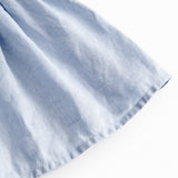 Ærmeløs kjole til børn med stropper og flæser på skulderen