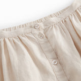 Beige nederdel til børn med sidelommer og knapper