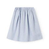 Lyseblå nederdel til børn med sidelommer og knapper