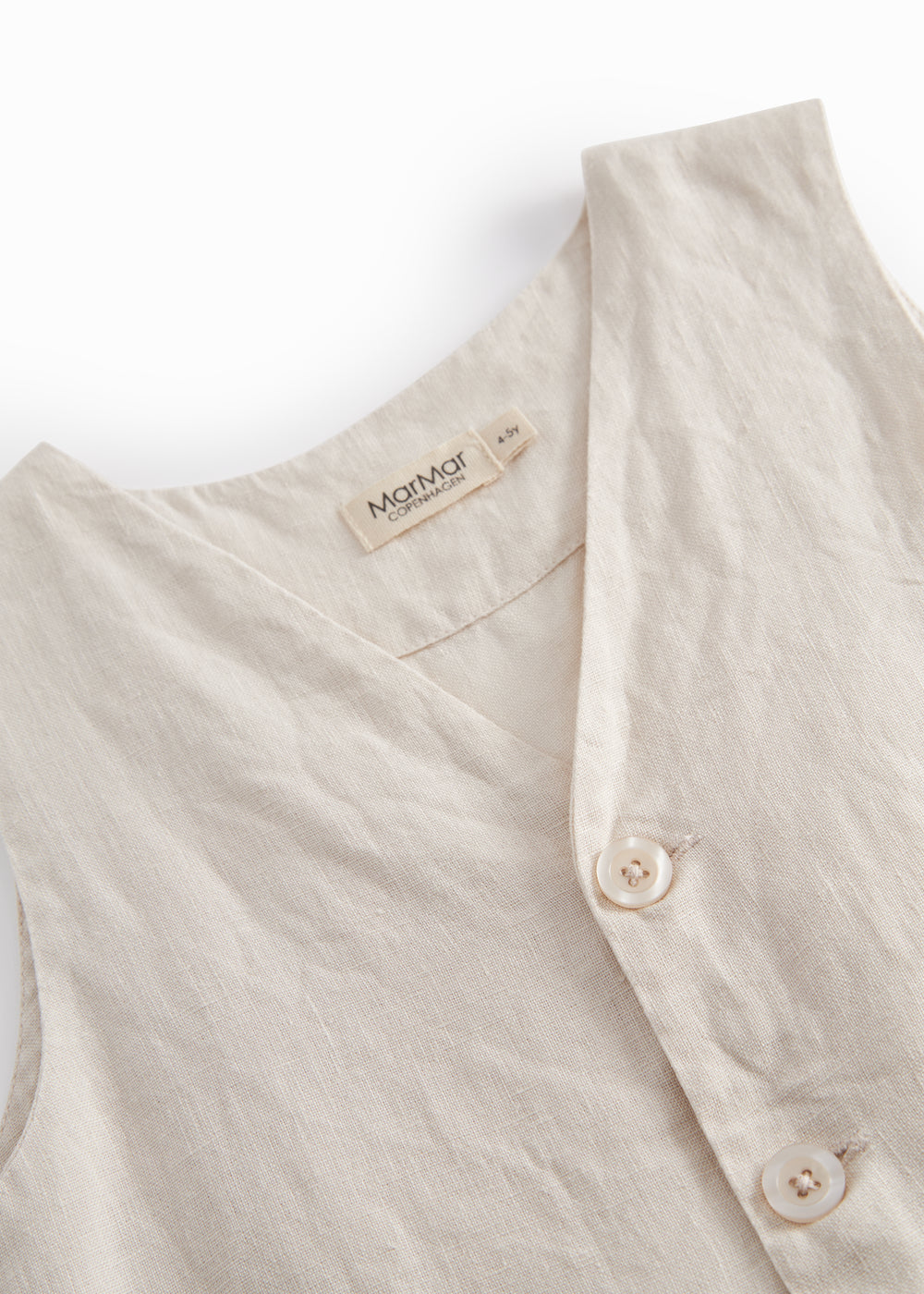 Beige vest til børn med knapper og lomme