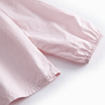 Lyserød børnebluse med krave og lange ærmer