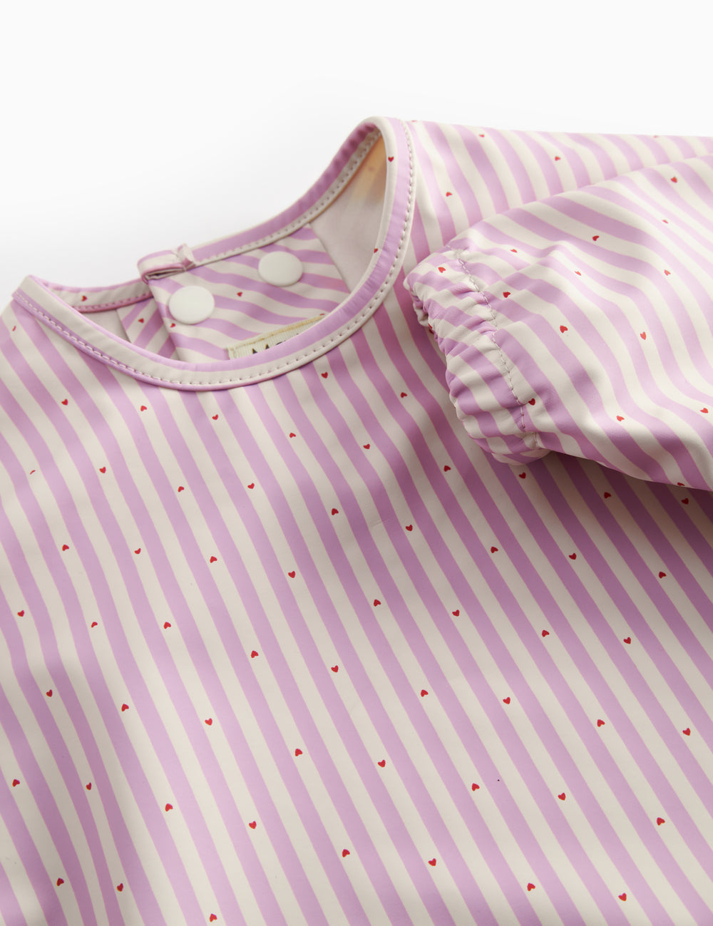 Langærmet spiseforklæde med lyserøde striber og lomme til børn
