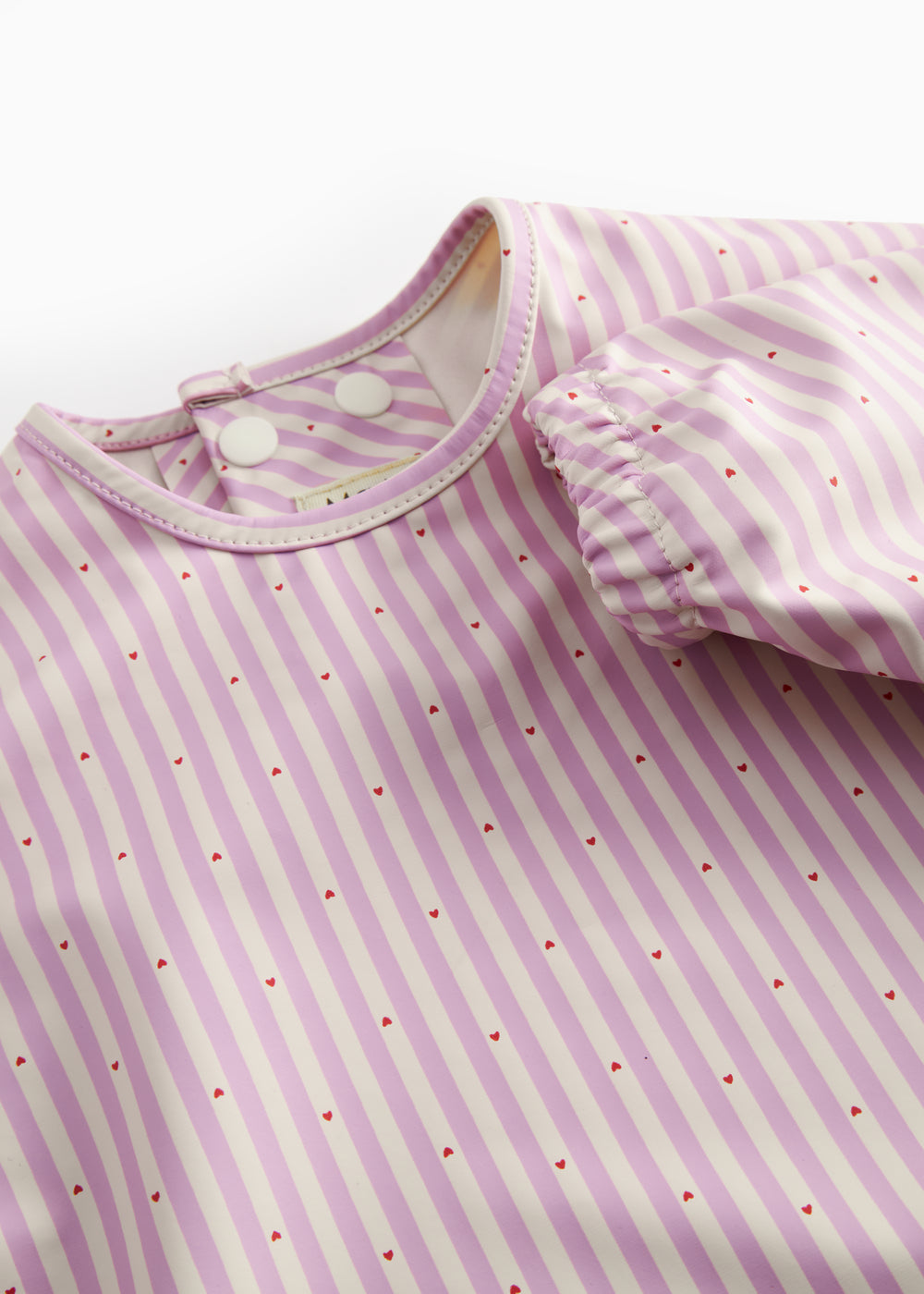 Langærmet spiseforklæde med lyserøde striber og lomme til børn