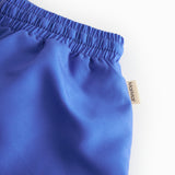 Blå badeshorts  med stropper til børn