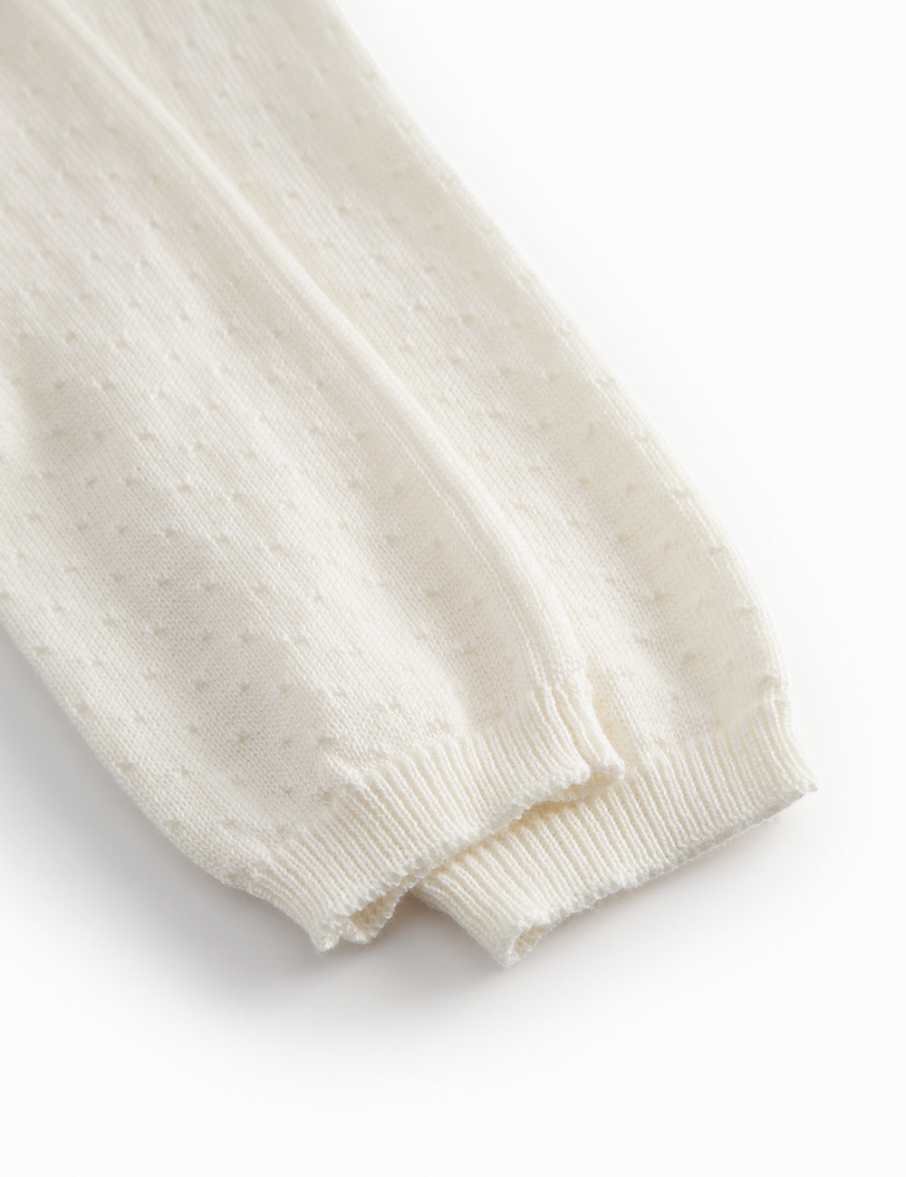 Hvide baby strikbukser med fint hulmønster